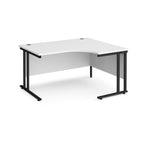 White corner desk with black legs on a white background