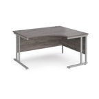 Corner office desk with wooden top and metal legs on a white background