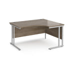 Corner office desk with wooden top and metal legs on a white background