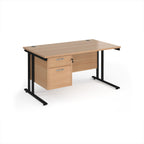 Wooden office desk with black legs and fixed pedestal on a white background