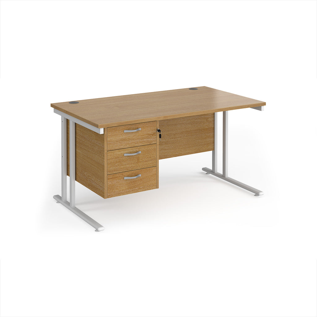 Wooden office desk with metal legs and three drawers on a white background