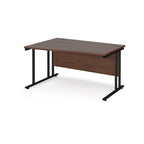 Wave desk with wood-effect top and black metal legs on a white background