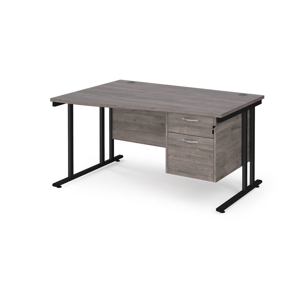 Wave desk with grey wood-effect top and matching pedestal with black frame on a white background
