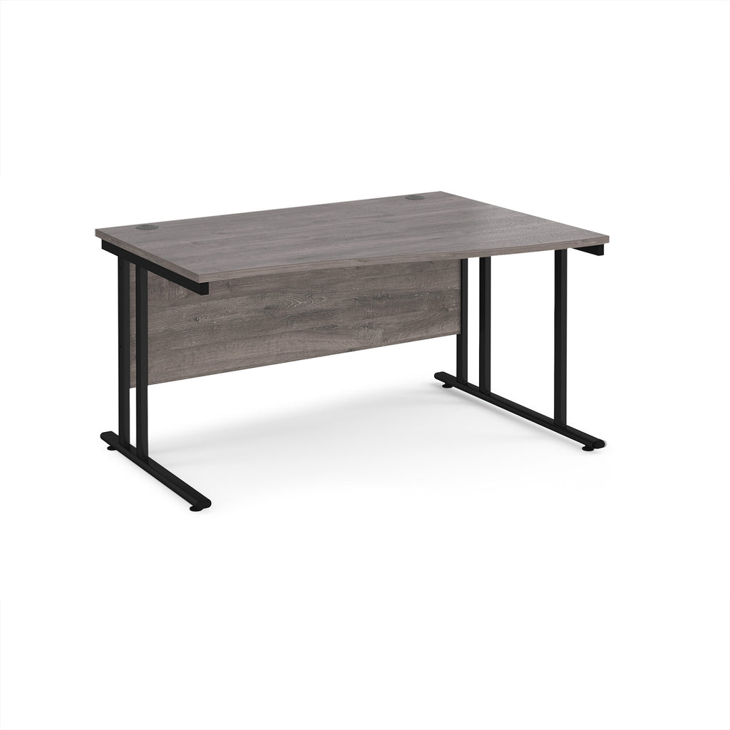 Wave desk with grey wood-effect top and black metal legs on a white background