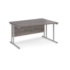 Wave desk with grey wood-effect top and silver metal legs on a white background