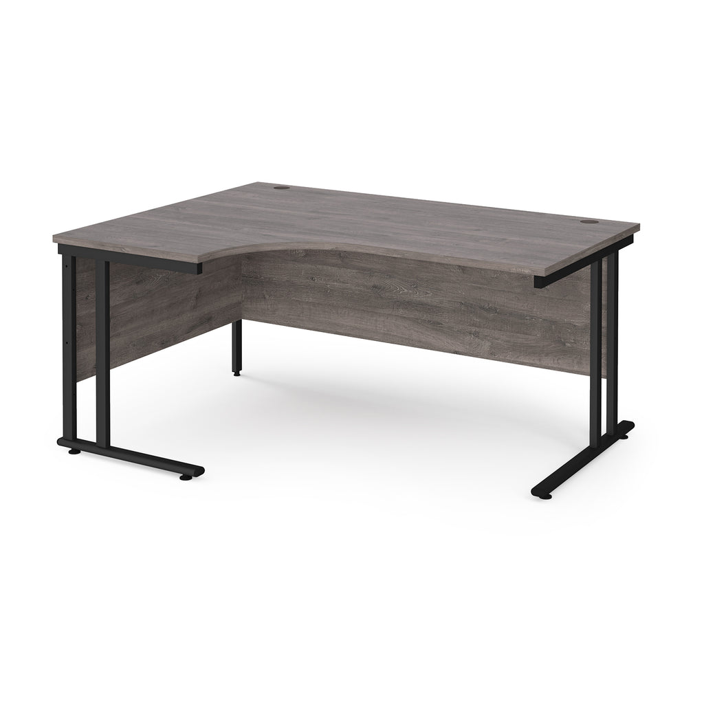 Corner office desk with wooden surface and black metal legs on a white background