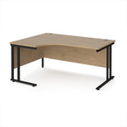 Corner office desk with wooden surface and black metal legs on a white background
