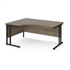 Corner office desk with wooden surface and black metal legs on a white background