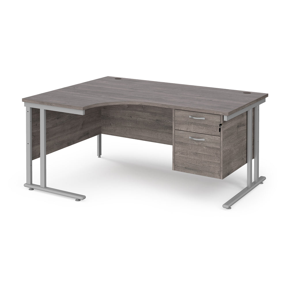 Ergonomic desk with grey wood-effect top and matching pedestal with silver frame on a white background
