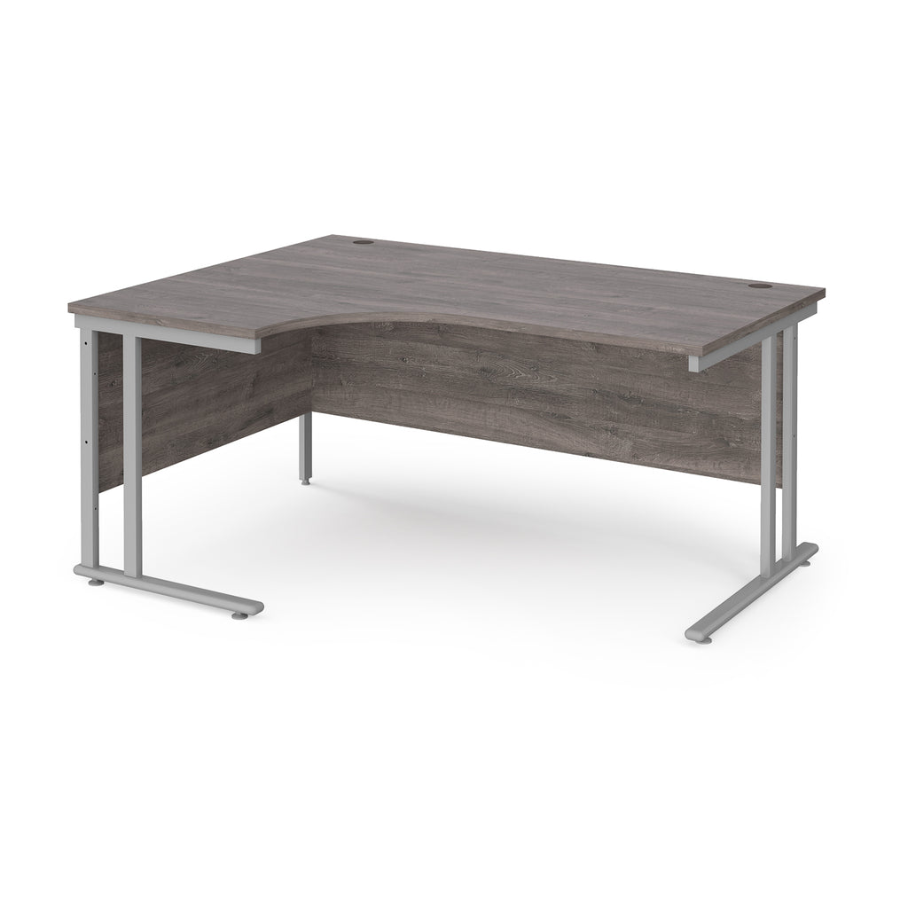 Corner office desk with wooden top and silver metal legs on a white background