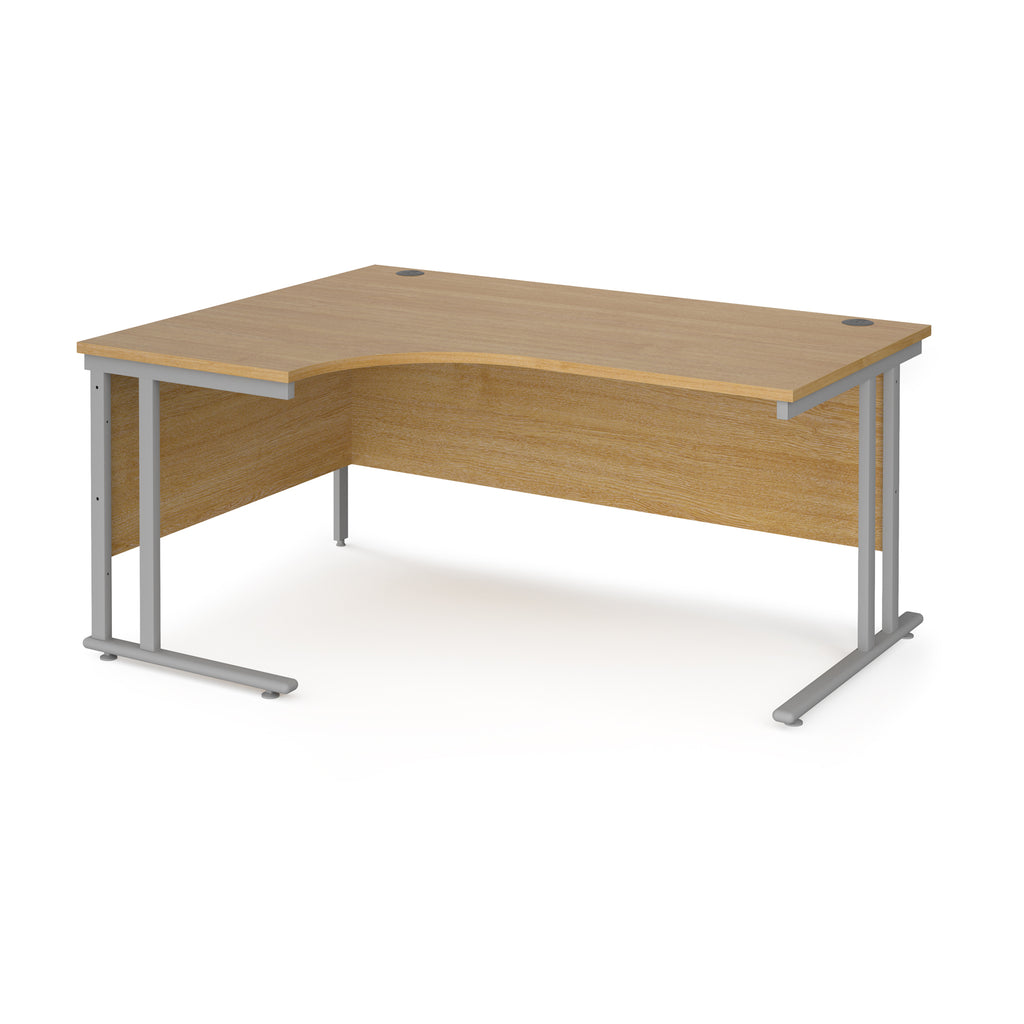 Wooden corner desk with silver metal legs on a white background