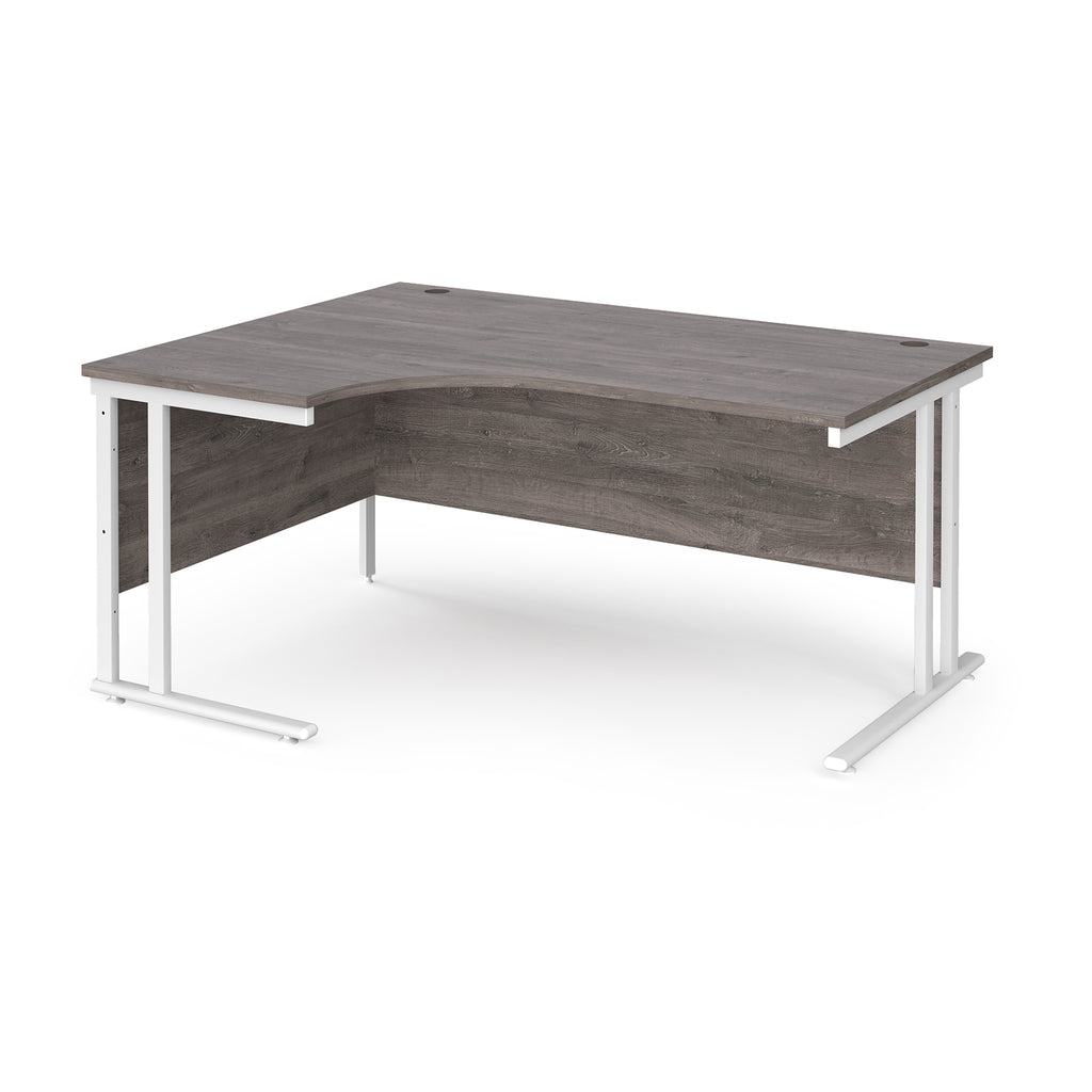Corner office desk with dark wood finish and white metal legs on a white background