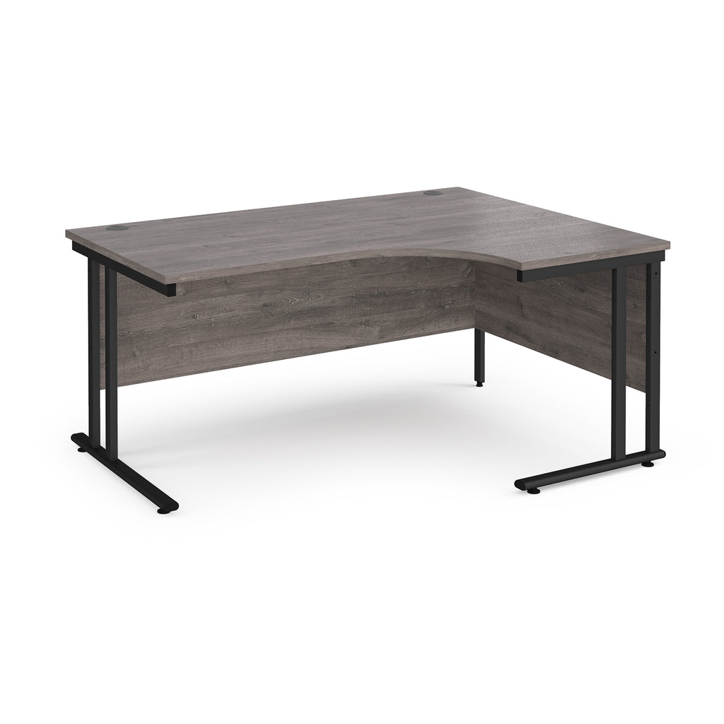 Corner office desk with wooden top and black metal legs on a white background