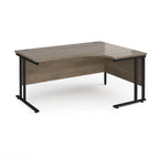 Corner office desk with wooden top and black metal legs on a white background