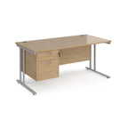 Wooden office desk with silver metal legs and fixed pedestal on a white background
