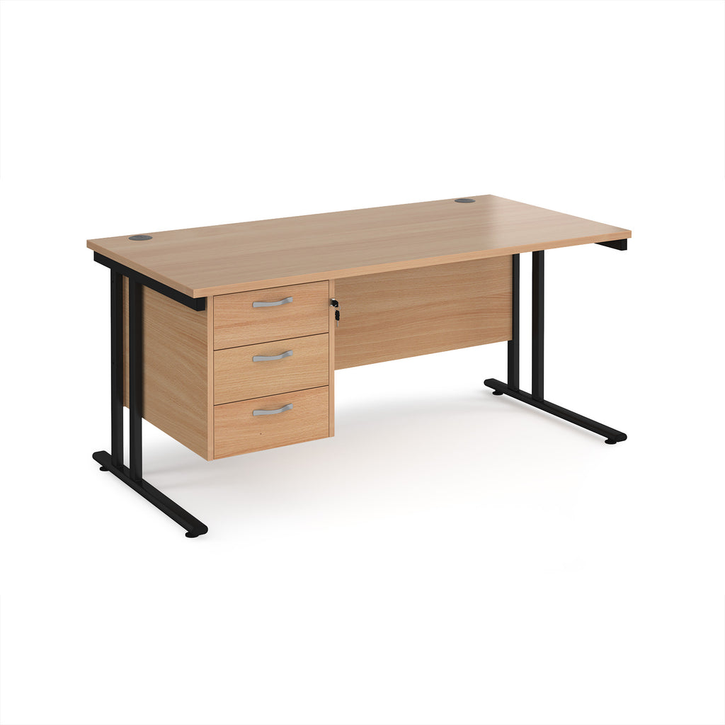 Wooden office desk with black legs and three drawers on a white background