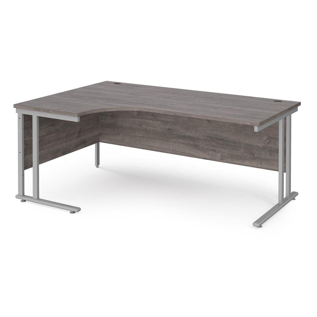 Corner office desk with wooden surface and metal frame on a white background