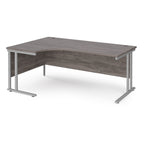 Corner office desk with wooden surface and metal frame on a white background