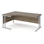 Corner office desk with wooden top and silver metal legs on a white background