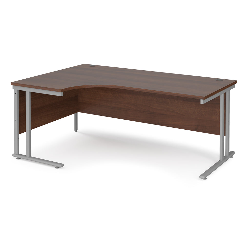 Wooden corner desk with silver metal legs on a white background