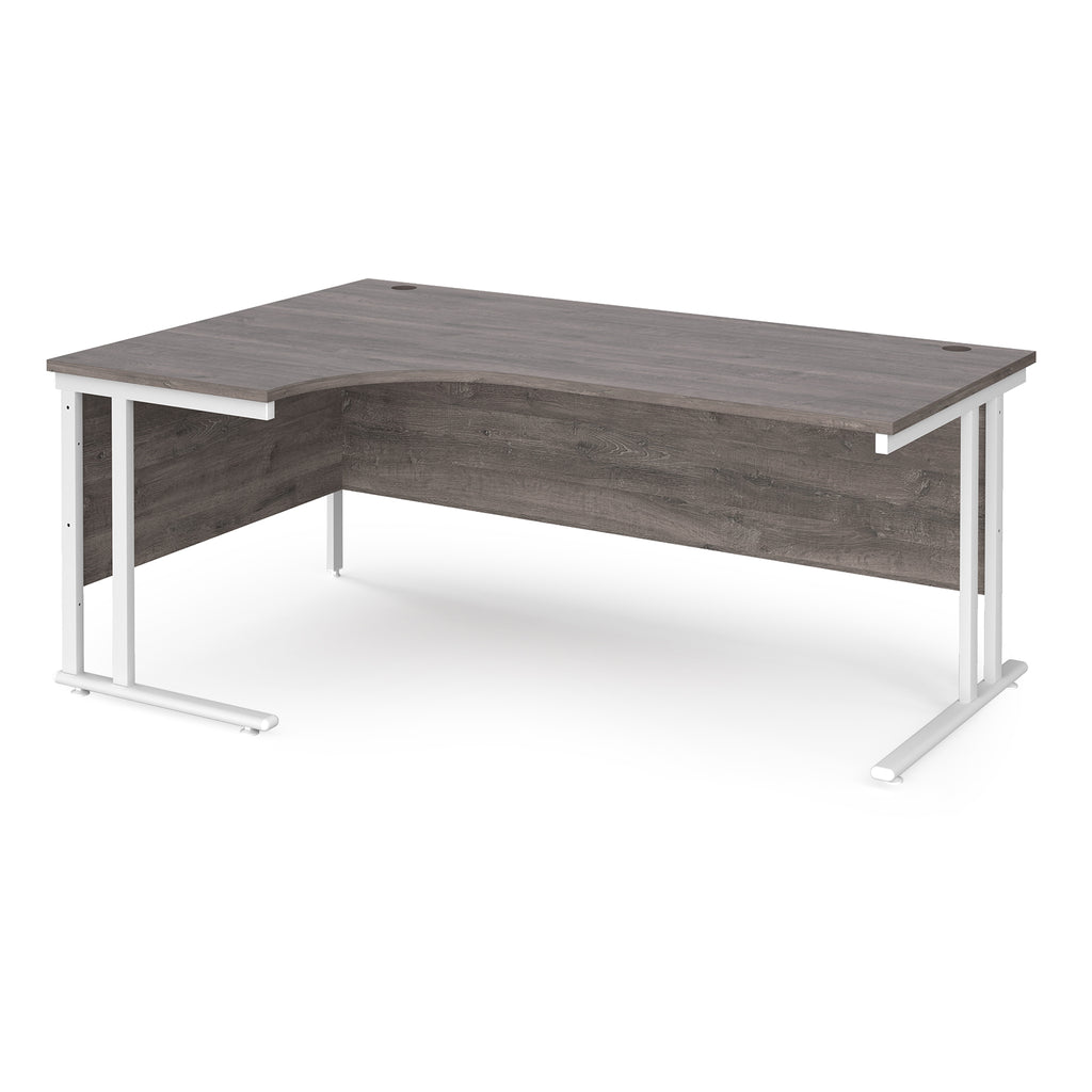 Corner office desk with wooden surface and white metal legs on a white background