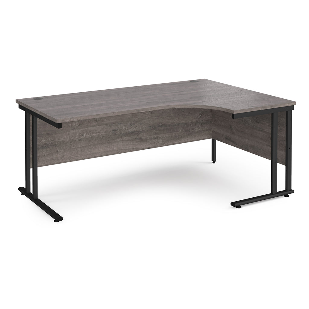 Corner office desk with wooden surface and black metal legs on a white background