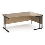 Corner desk with wooden surface and black metal legs on a white background