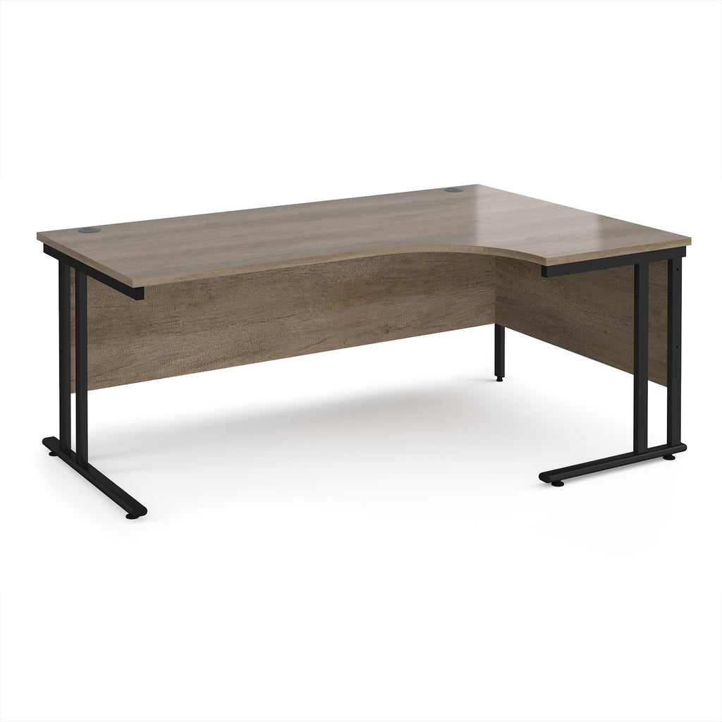 Corner office desk with wooden surface and black metal legs on a white background