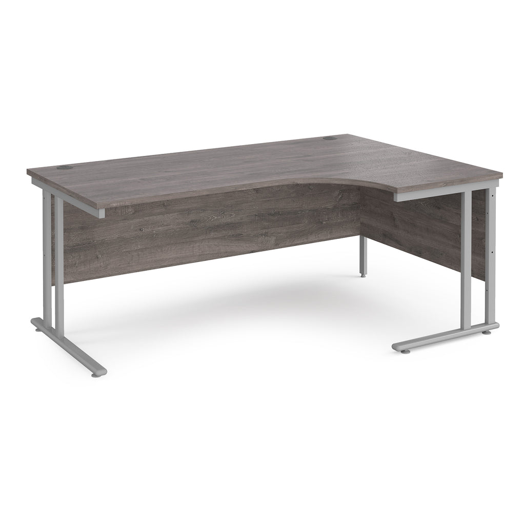Corner office desk with wooden surface and metal legs on a white background