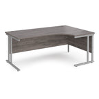 Corner office desk with wooden surface and metal legs on a white background
