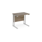 Wooden desk with white metal legs on a white background
