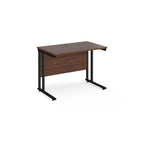 Wooden desk with black metal legs on a white background