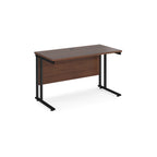 Wooden desk with black metal legs on a white background