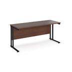 Wooden desk with black metal legs on a white background