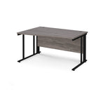 Wave desk with grey wood-effect top and black metal frame on a white background