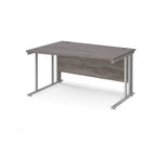 Wave desk with grey wood-effect top and silver metal frame on a white background