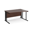 Wave desk with wood-effect top and black metal frame on a white background
