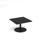 Black square coffee table with round base on a white background