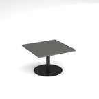 Square coffee table with a grey top and black round base on a white background