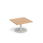 Square coffee table with wood-effect top and white round base on a white background