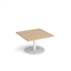 Square coffee table with wood-effect top and white round base on a white background