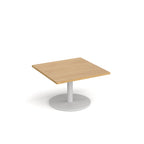 Square coffee table with wood-effect top and white round base on a white background