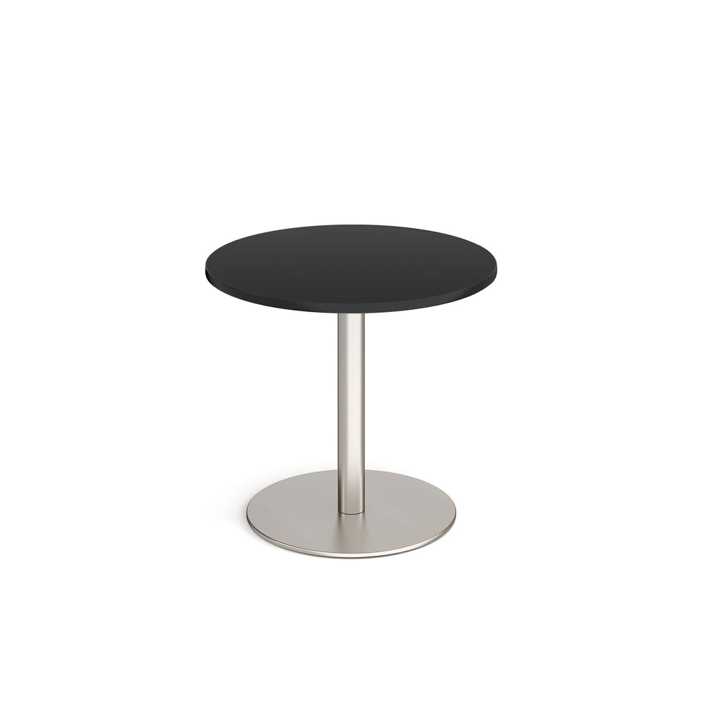 Round table with black top and metal base on a white background