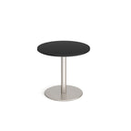 Round table with black top and metal base on a white background