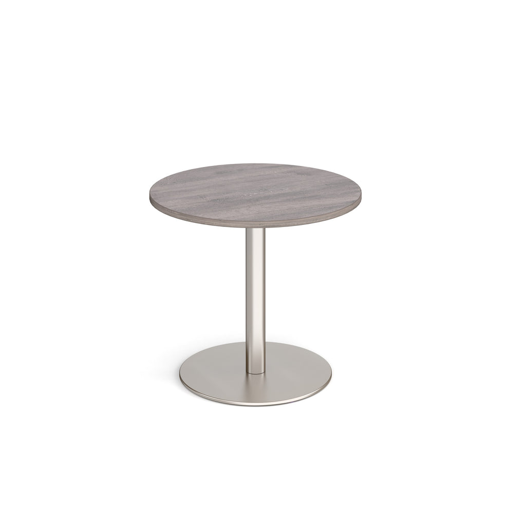 Round table with grey wood-effect top and metal base on a white background