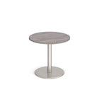 Round table with grey wood-effect top and metal base on a white background