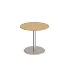 Round table with wood-effect top and metal base on a white background