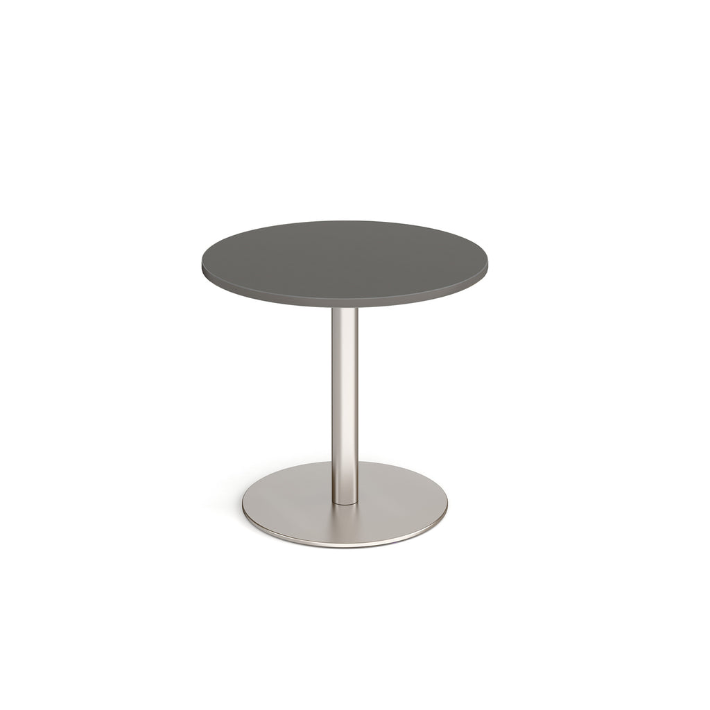 Round table with grey top and metal base on a white background
