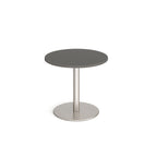 Round table with grey top and metal base on a white background