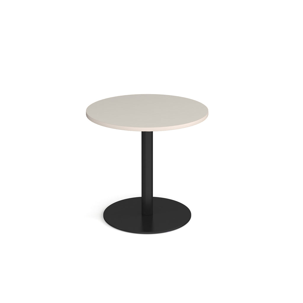Round table with a light grey top and black base on a white background